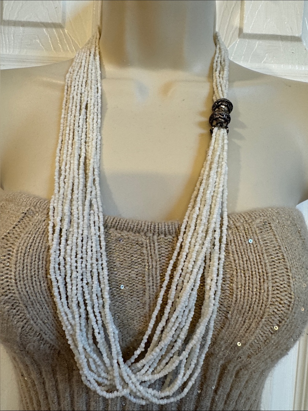 Vintage white necklace multi-strand seed beads and silver tone metal ornament
